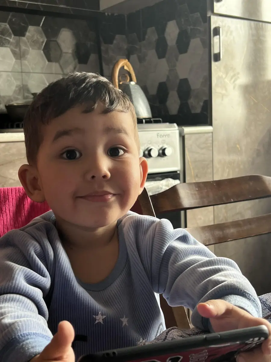Husan Mavlonov with his younger brother, Uzbekistan, summer 2022