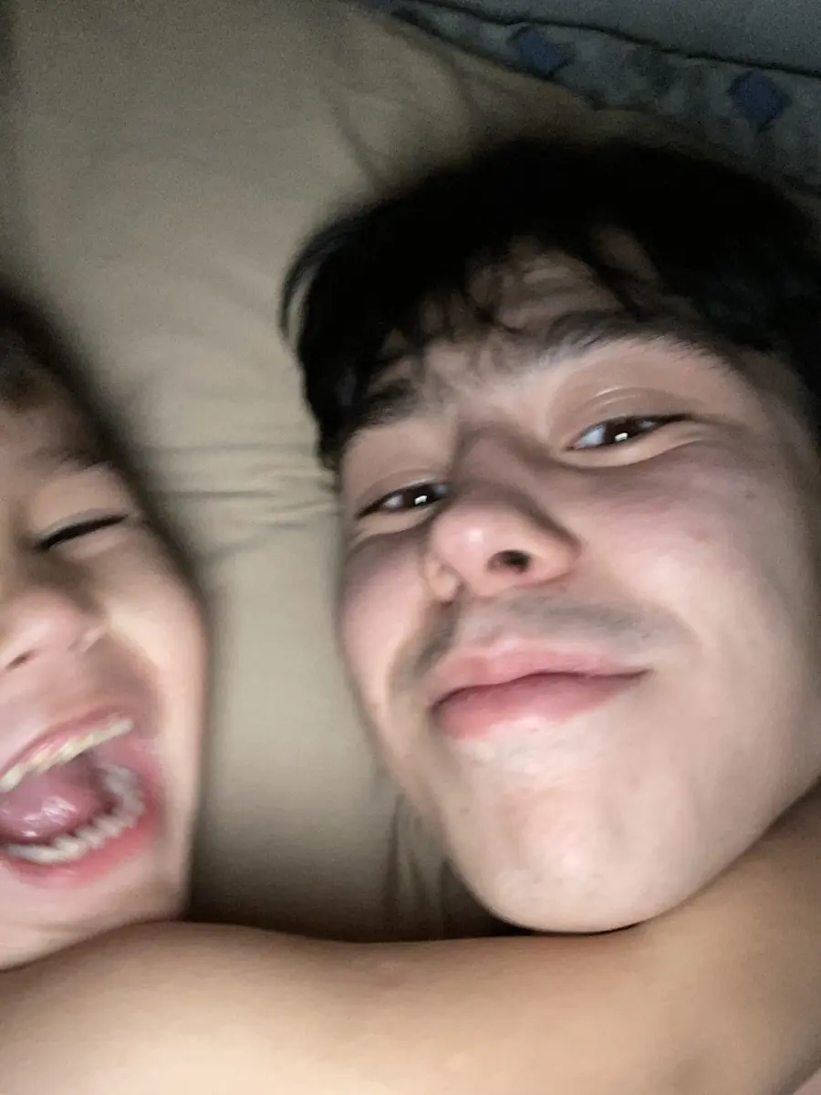 Husan Mavlonov playing with his younger brother, Uzbekistan, 2022